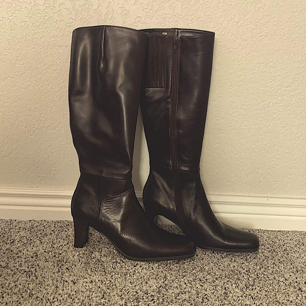 Brown leather high heel boots.